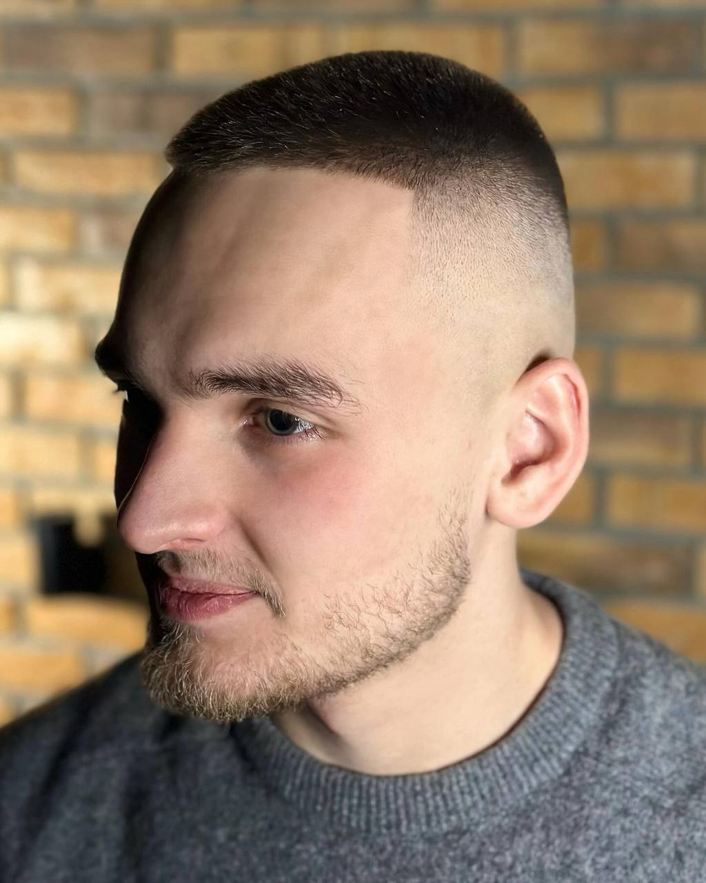 Buzzcut haircut, profile view, by barber Alex at BRODSKI Barbershop Wilanów, Warszawa