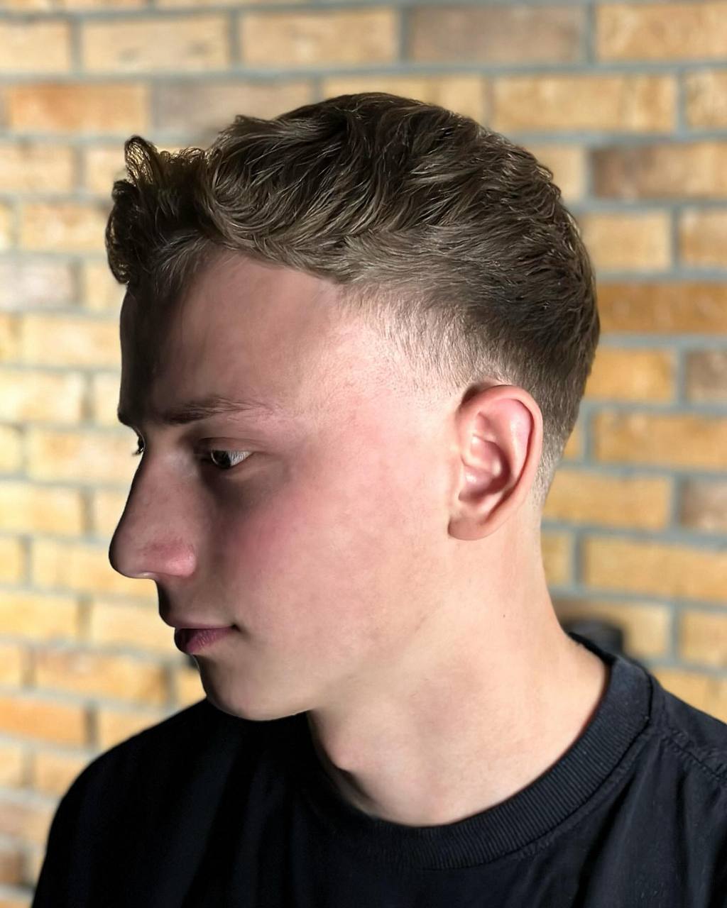 French crop haircut, profile view, by barber Alex at BRODSKI Barbershop Wilanów, Warszawa